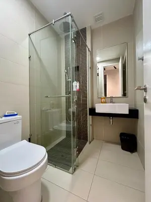 a bathroom with a shower and a toilet and a sink at KL Central 32 Floor KLCC View in Kuala Lumpur