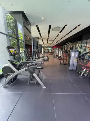 a gym with a row of chairs in a building at Star Residences One in Kuala Lumpur