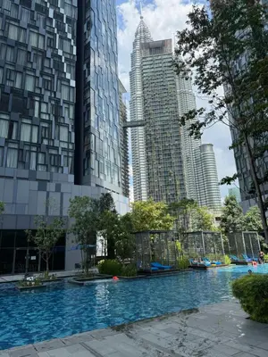 a swimming pool in a city with tall buildings at Star Residences One in Kuala Lumpur