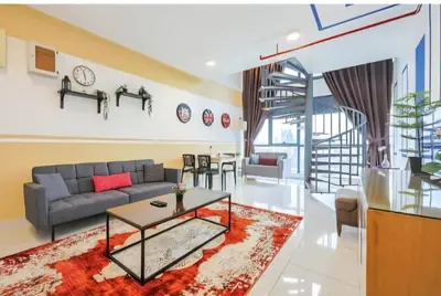 a living room with a couch and a table at Bmc Homez Suite 3towers in Kuala Lumpur