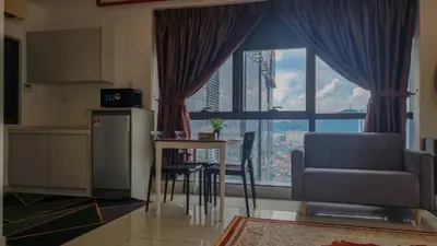 a kitchen with a table and a chair and a window at Bmc Homez Suite 3towers in Kuala Lumpur