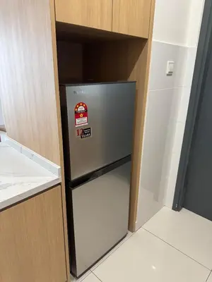 a small refrigerator in a kitchen with its door open at Mont kiara warmly 6 pax stay in Kuala Lumpur