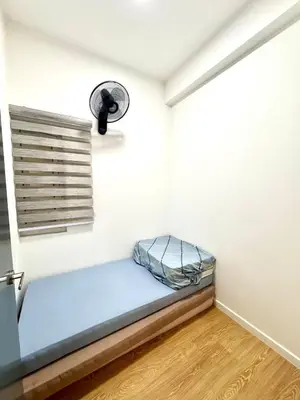 a small room with a bed and a window at 3Room 5 Pax stay in Mont Kiara in Kuala Lumpur