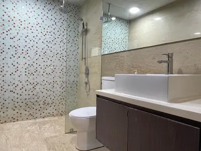 a bathroom with a sink and a toilet and a shower at Regalia Residences And Suites By The Relaxstay in Kuala Lumpur
