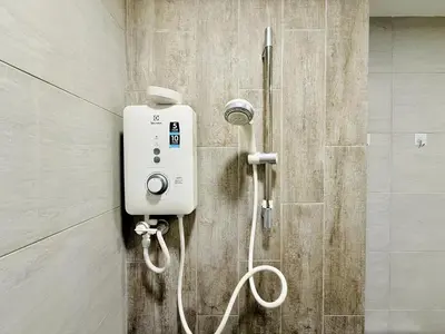 a shower in a bathroom with a whiteitizer at Arte Plus Ampang By The Relaxstay in Kuala Lumpur