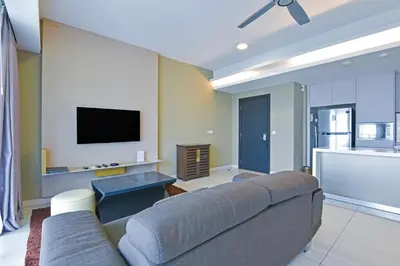 a living room with a couch and a flat screen tv at Palette Bukit Bintang Formerly Suasana Suites in Kuala Lumpur
