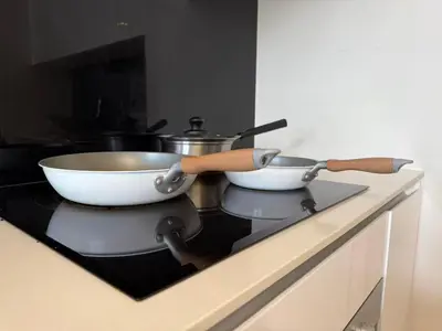 two bowls on top of a stove in a kitchen at Star Residences One in Kuala Lumpur