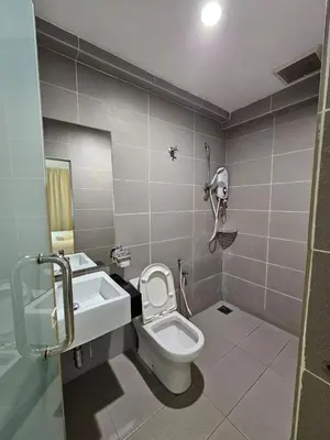 a bathroom with a toilet and a sink at V Garden Hotel by Minsu in Kuala Lumpur