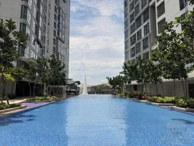 a large swimming pool between two tall buildings at Cozy Minimalist Condo In The Heart of Kuala Lumpur City 1BR in Kuala Lumpur