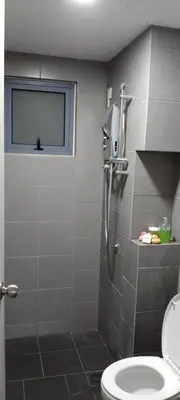 a bathroom with a toilet and a window at KL Comfy Masterbedroom wt bathroom in Kuala Lumpur
