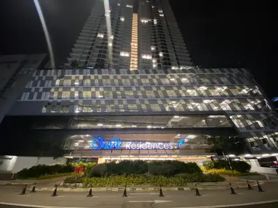 a large building with a sign in front of it at Comfort Cove in Kuala Lumpur