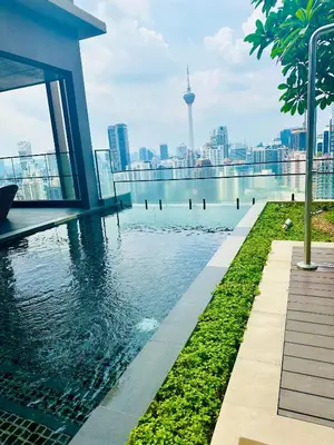 a swimming pool on a building with a view of the city at AXON RESiDENCE AT SERViCE APARTMENT in Kuala Lumpur