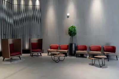 a waiting room with chairs and a potted plant at Kuala Lumpur M Vertica Residence I Big Family Homestay \u5927\u5bb6\u5ead\u9002\u4f4f I Walking distance to MRT I \u9a6c\u4e2d\u82f1\u6587\u670d\u52a1 I Malay English Chinese in Kuala Lumpur
