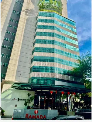 a tall building with a tree on top of it at Exclusive Suites Bukit Bintang KL in Kuala Lumpur