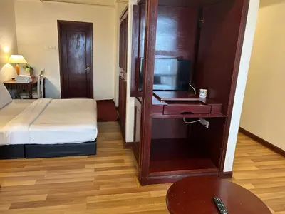 a hotel room with a bed and a television at EVERYDAY SERVICE SUITE at TIMES SQUARE in Kuala Lumpur
