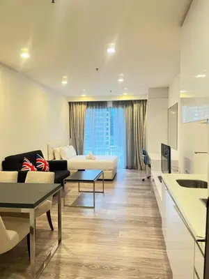 a living room with a couch and a table at One Bukit Ceylon AT Bukit Bintang Kuala Lumpur in Kuala Lumpur
