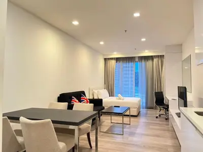 a living room with a couch and a table at One Bukit Ceylon AT Bukit Bintang Kuala Lumpur in Kuala Lumpur
