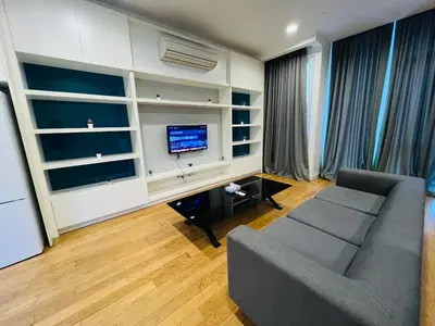 a living room with a couch and a tv at The Platinum KLCC by Dream Suites in Kuala Lumpur
