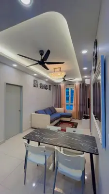 a dining room and living room with a ceiling fan at JMZ homestay in Kuala Lumpur