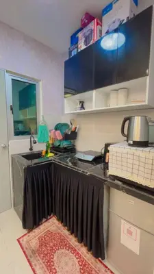 a kitchen with a sink and a counter top at JMZ homestay in Kuala Lumpur