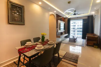 a dining room with a table and chairs in a room at 3BR LSH33 KL Duke Highway Genting Free Parking in Kuala Lumpur