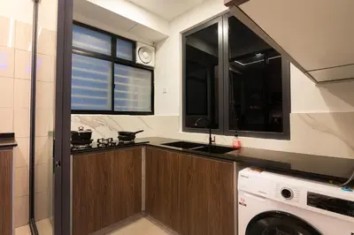 a kitchen with a washing machine and a window at 3BR LSH33 KL Duke Highway Genting Free Parking in Kuala Lumpur