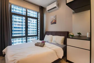 a bedroom with a bed and a large window at 3BR LSH33 KL Duke Highway Genting Free Parking in Kuala Lumpur