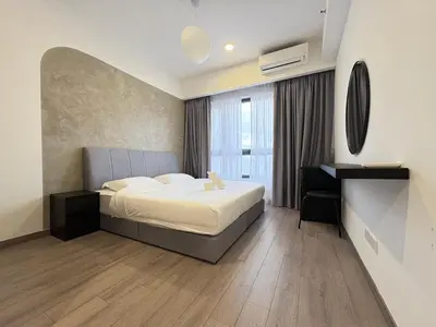a bedroom with a bed and a desk in it at Agile Bukit Bintang BNB at KLCC #Located in TRX #5 mins to Pavilion &Bukit Bintang #Infinity Pool #Free Parking #中英文房东 in Kuala Lumpur