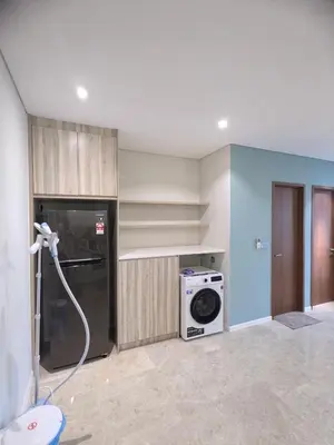 a kitchen with a refrigerator and a washing machine at Urban Sky Home with KLCC view at SKY SUITES Two Bed Rooms Apartment in Kuala Lumpur