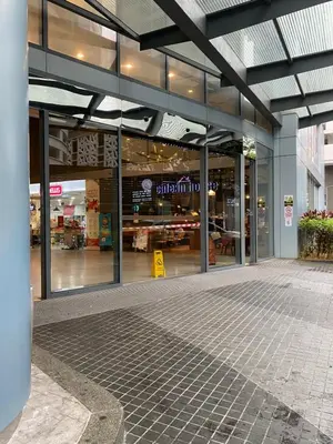 a store front of a shopping center with glass windows at Summer Suites KLCC by Angel in Kuala Lumpur