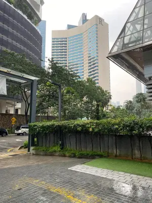 a city street with tall buildings in the background at Summer Suites KLCC by Angel in Kuala Lumpur