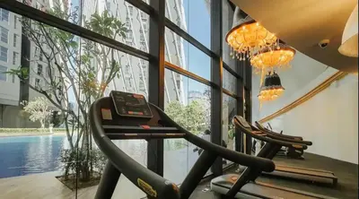 a gym with two treadmills in a building at Scenic Living Homestay Studio in Kuala Lumpur
