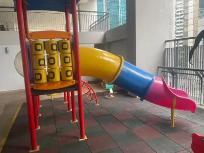 a playground with a slide and a chair at Raafah Kl suits At Seri bukit Ceylon,bukit bintang in Kuala Lumpur