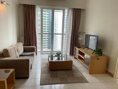 a living room with a couch and a tv at Raafah Kl suits At Seri bukit Ceylon,bukit bintang in Kuala Lumpur