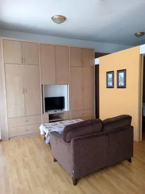 a living room with a couch and a flat screen tv at Park view klcc by Alan in Kuala Lumpur