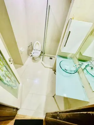 a bathroom with a toilet and a sink at Park view klcc by Alan in Kuala Lumpur
