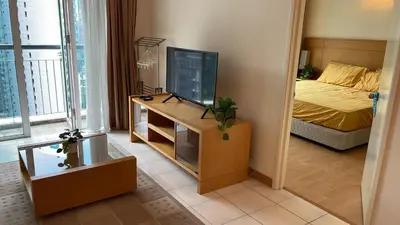 a room with a bed and a television on a table at City centre, Bukit Bintang in Kuala Lumpur