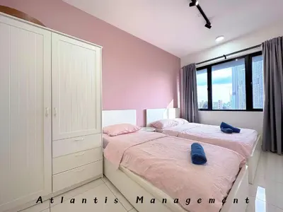 a bedroom with two beds and a large window at Parc 3, Taman Pertama, Kuala Lumpur By Atlantis Management in Kuala Lumpur