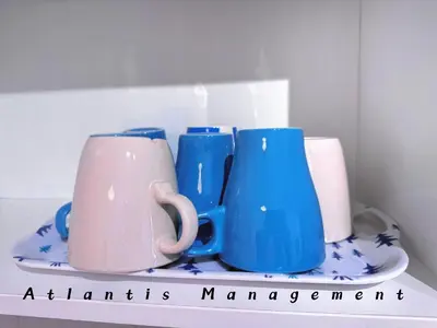 a group of blue and pink mugs on a shelf at Parc 3, Taman Pertama, Kuala Lumpur By Atlantis Management in Kuala Lumpur