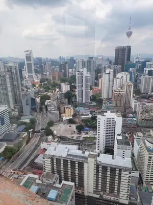 an aerial view of a city with tall buildings at Snowfall suite at berjaya Times Square in Kuala Lumpur