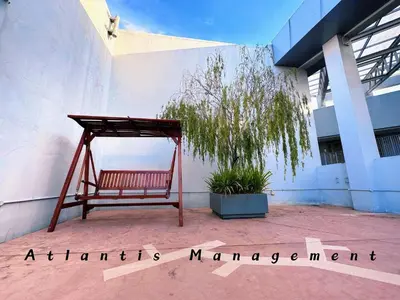 a bench sitting on the side of a building at Parc 3, Sunway Velocity in Kuala Lumpur