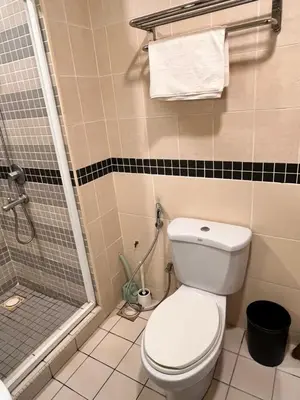 a bathroom with a toilet and a shower at Seri Bukit Ceylon Bukit Bintang in Kuala Lumpur