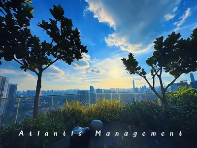 a view of a city skyline with trees and the sunset at Parc 3 KL South Cozy Apartment, Walking Distance to AEON Maluri & Sunway Velocity in Kuala Lumpur