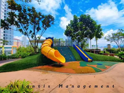 a playground with a slide in a park at Parc 3 KL South Cozy Apartment, Walking Distance to AEON Maluri & Sunway Velocity in Kuala Lumpur