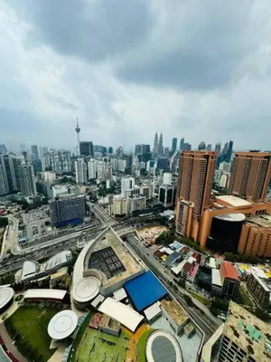 an aerial view of a city with tall buildings at Lucentia Residences BBCC LaLaport in Kuala Lumpur