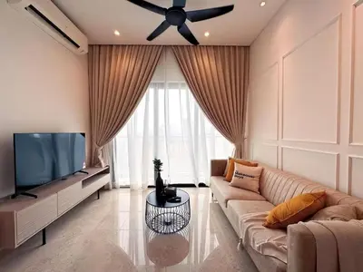 a living room with a couch and a flat screen tv at Lucentia Residences BBCC LaLaport in Kuala Lumpur