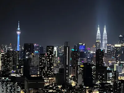 a nighttime view of a large city at night at TrionKL Luxury Stay 2BR Free Wi-Fi 10min to KLCC - Chinese Host in Kuala Lumpur