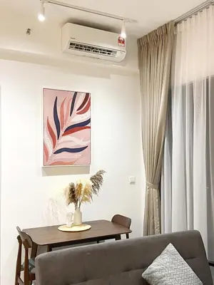 a living room with a couch and a table at TrionKL Luxury Stay 2BR Free Wi-Fi 10min to KLCC - Chinese Host in Kuala Lumpur
