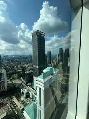 a view of a city from the top of a skyscraper at Sleep in the Sky KLCC View in Kuala Lumpur