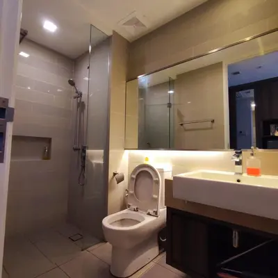 a bathroom with a toilet and a sink and a shower at One Bukit Ceylon KLCC in Kuala Lumpur